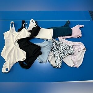 NWOT 5 one piece women’s bathing suits. Size XS